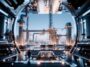 Logo di Google e TAE Technologies con simbolo di fusione nucleare
